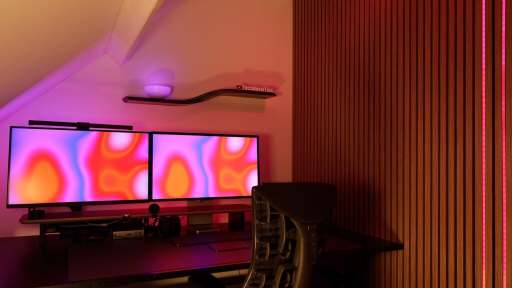 Apple Studio Display XDR desk setup with dual monitors and minimal lighting